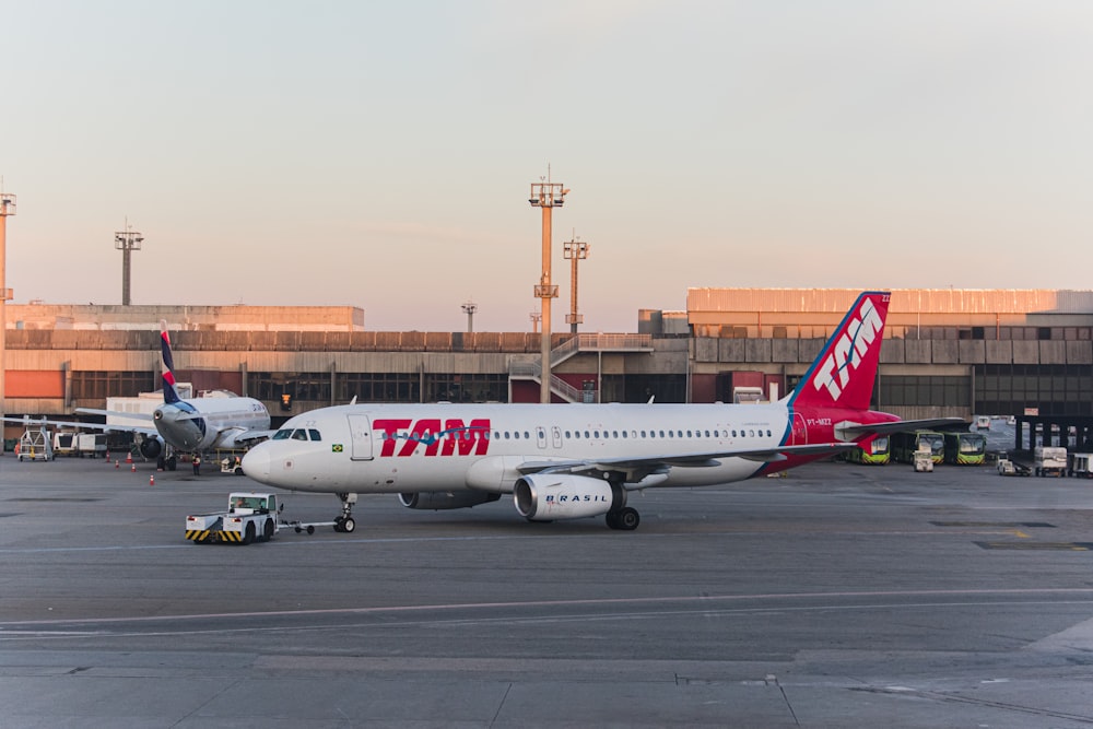 a large jetliner sitting on top of an airport tarmac