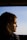 a woman looking out the window of a bus