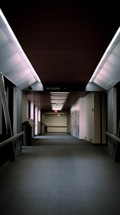 a long hallway with a light on the ceiling