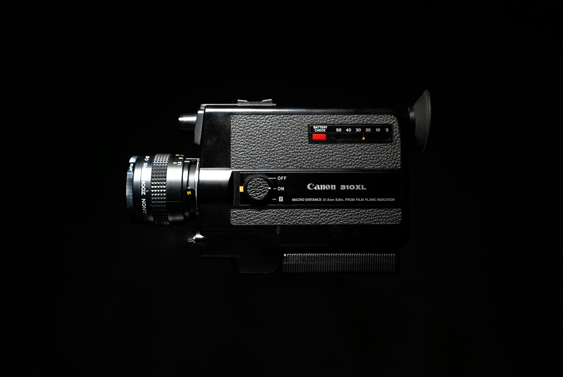 a black camera with a red light on it