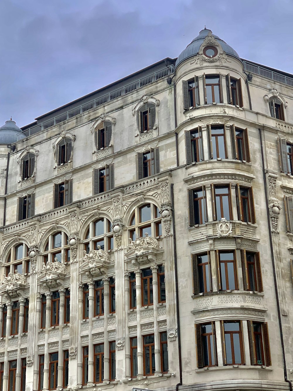 a large building with many windows and a clock on it