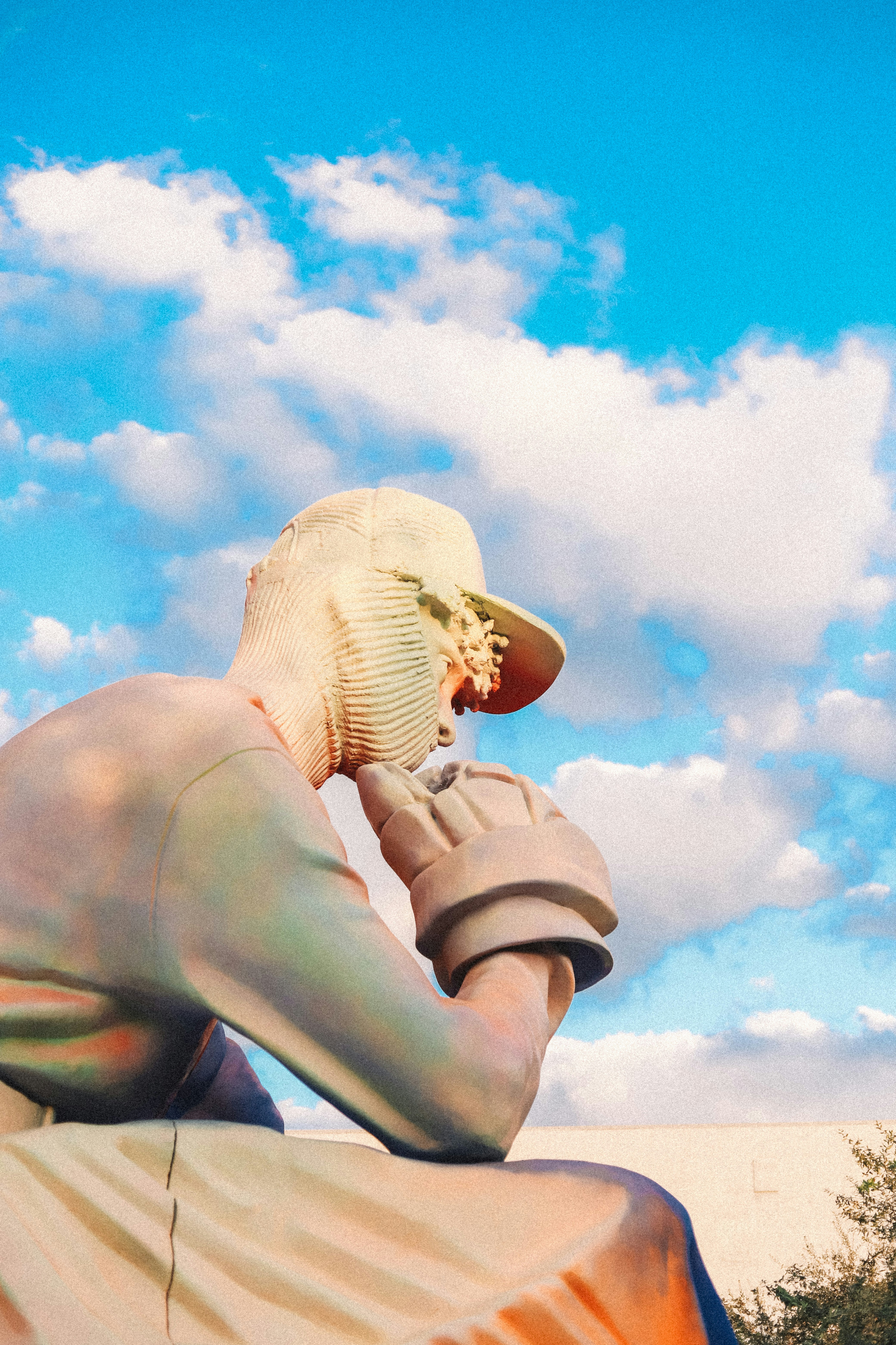 a statue of a person with a hat on