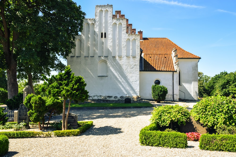 a large white building with a red roof