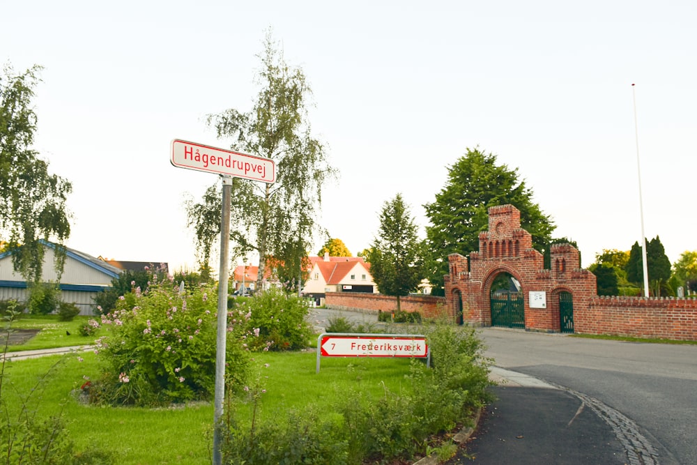 a street sign in front of a brick building