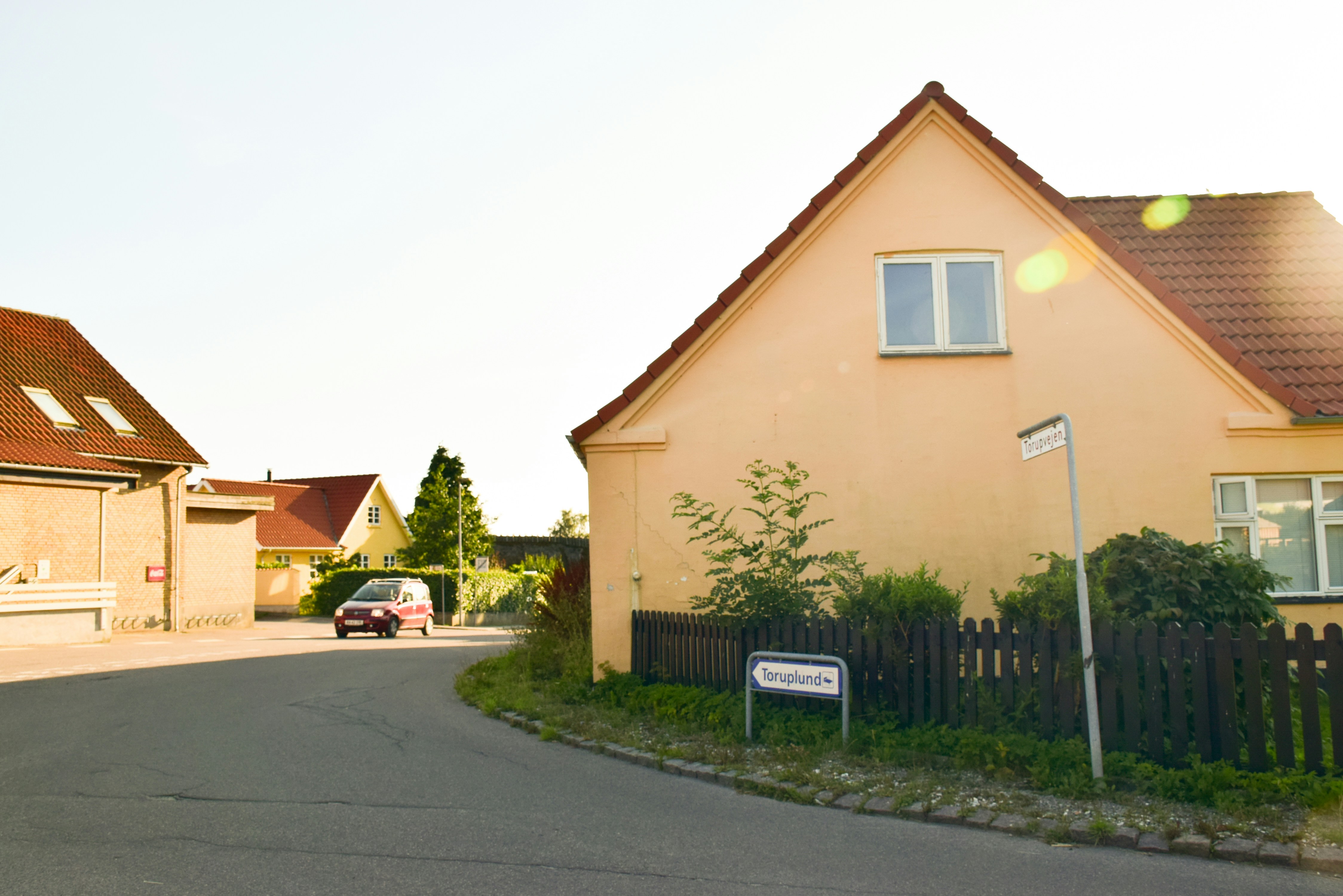 A car is parked in front of a house photo Free Denmark Image on Unsplash