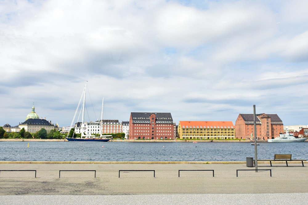 a body of water with a bunch of buildings in the background