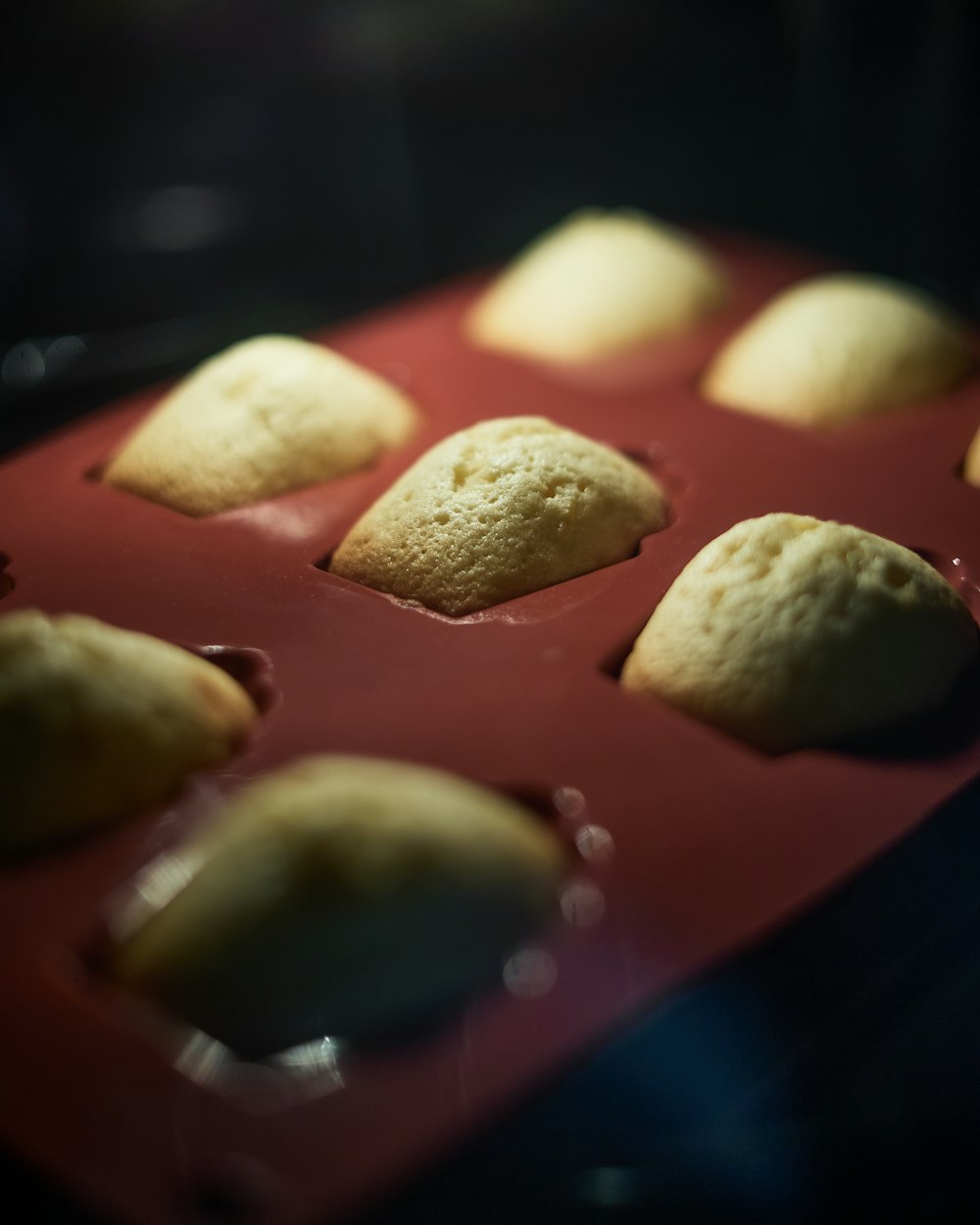 a muffin pan filled with muffins on top of a table