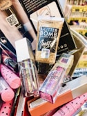a pile of cosmetics and other items on a table