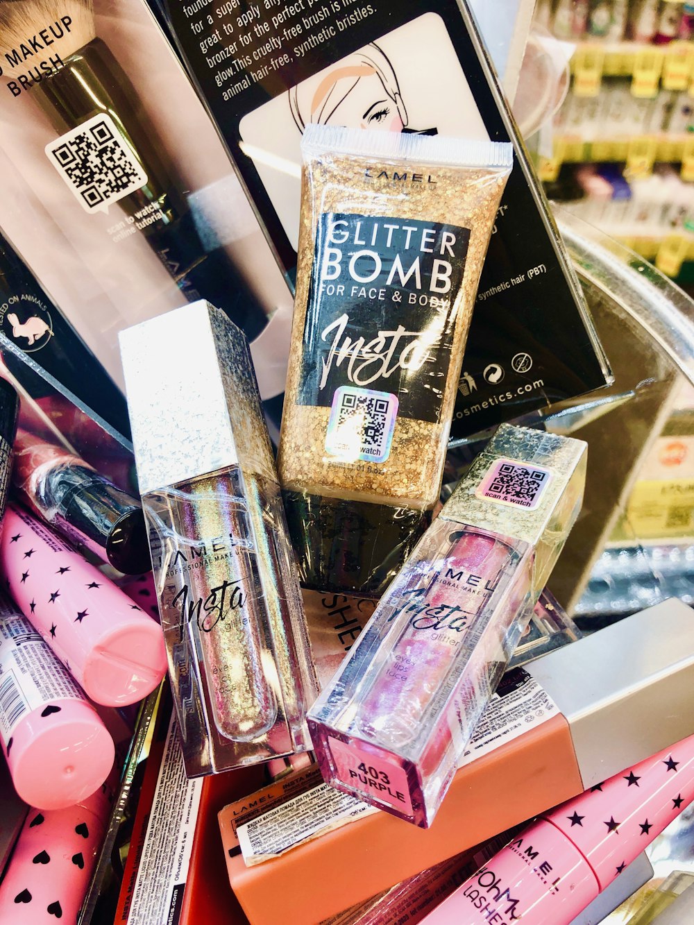 a pile of cosmetics and other items on a table