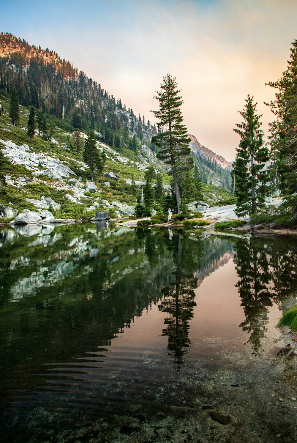 a mountain lake surrounded by trees and rocks