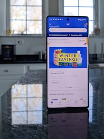 Close-up of a smartphone displaying the daily deal on thatsadeal.com.au.