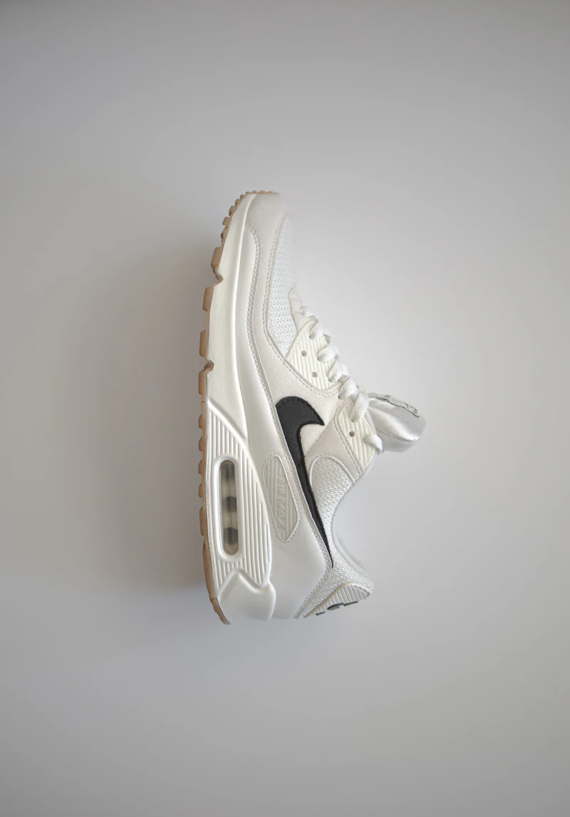 A pair of trainers on a plain ground