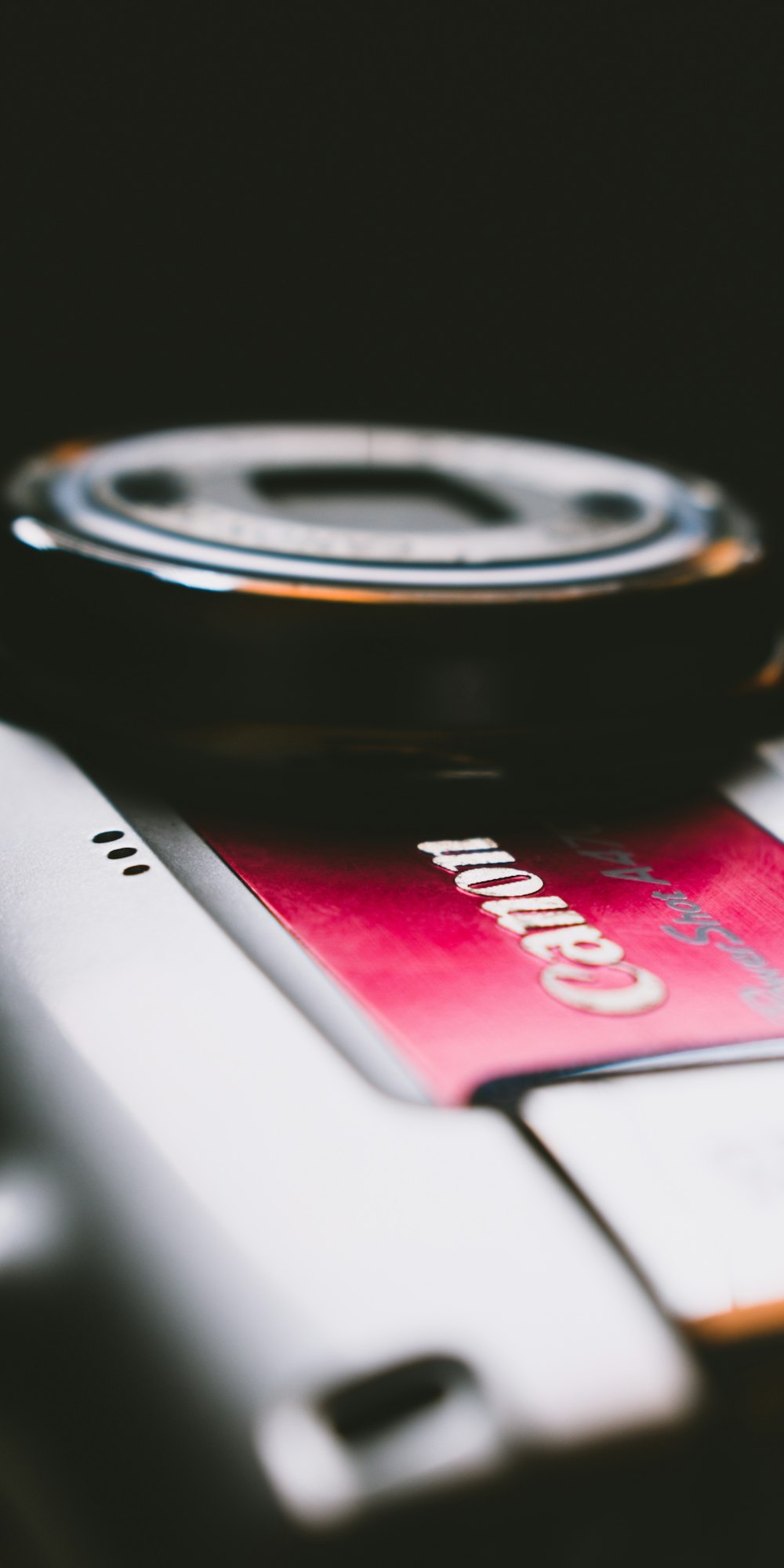 a close up of a cell phone and a credit card