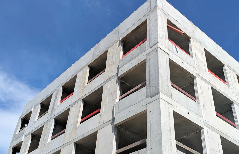 Concrete building structure against a clear sky