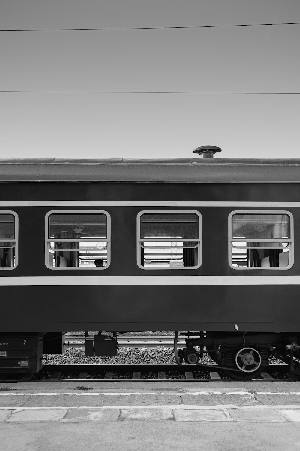 a black and white photo of a train