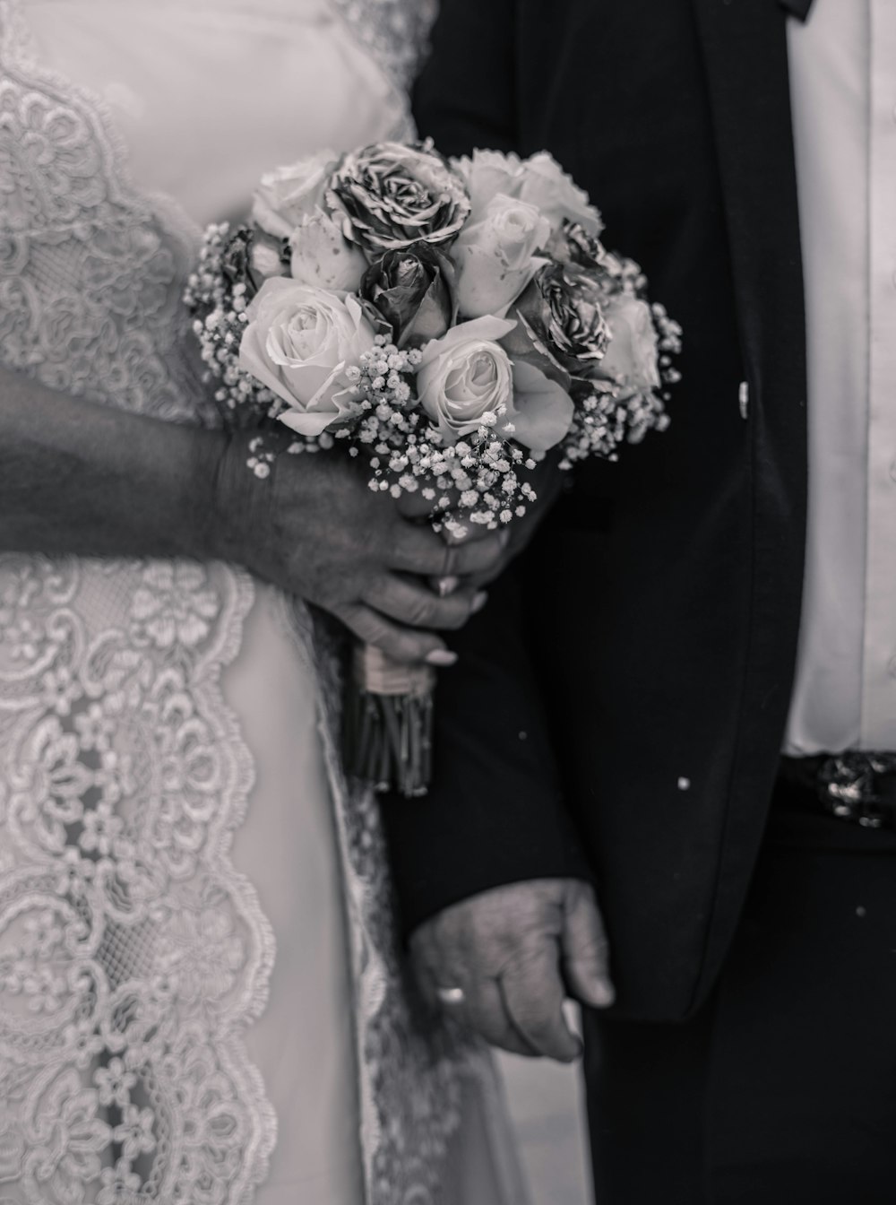 a man and a woman holding flowers in their hands