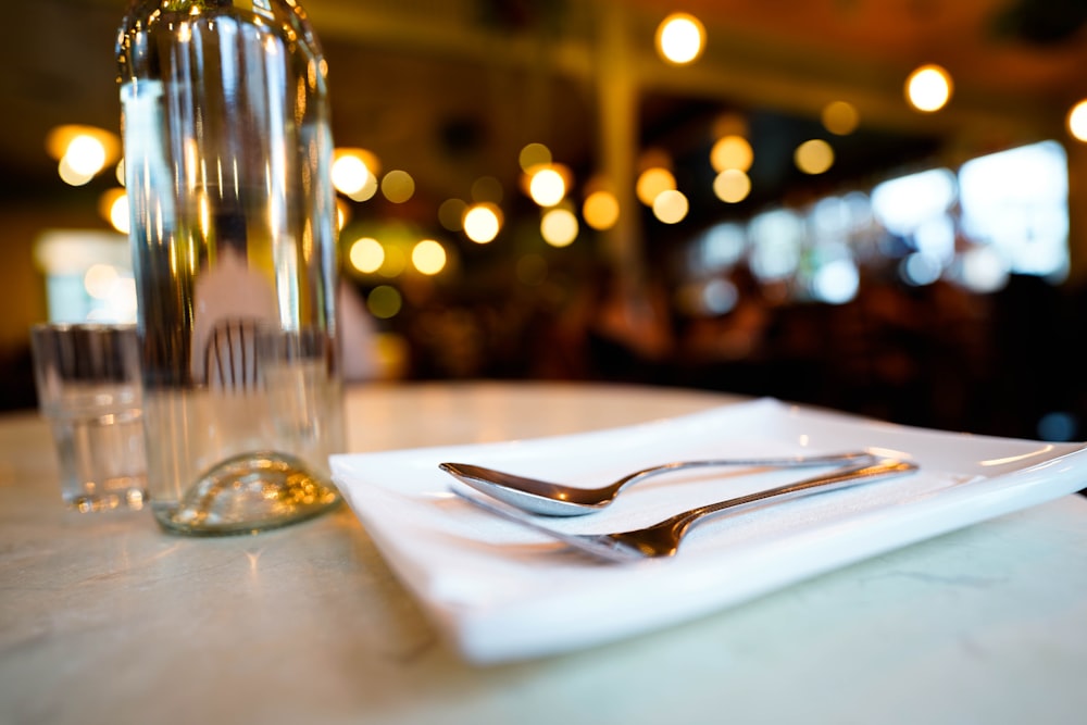 a white plate with a fork and knife on it