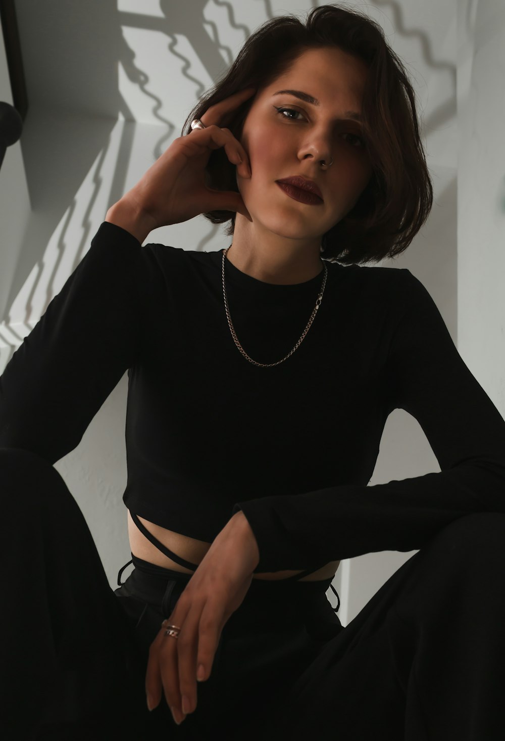 a woman in a black shirt and black pants