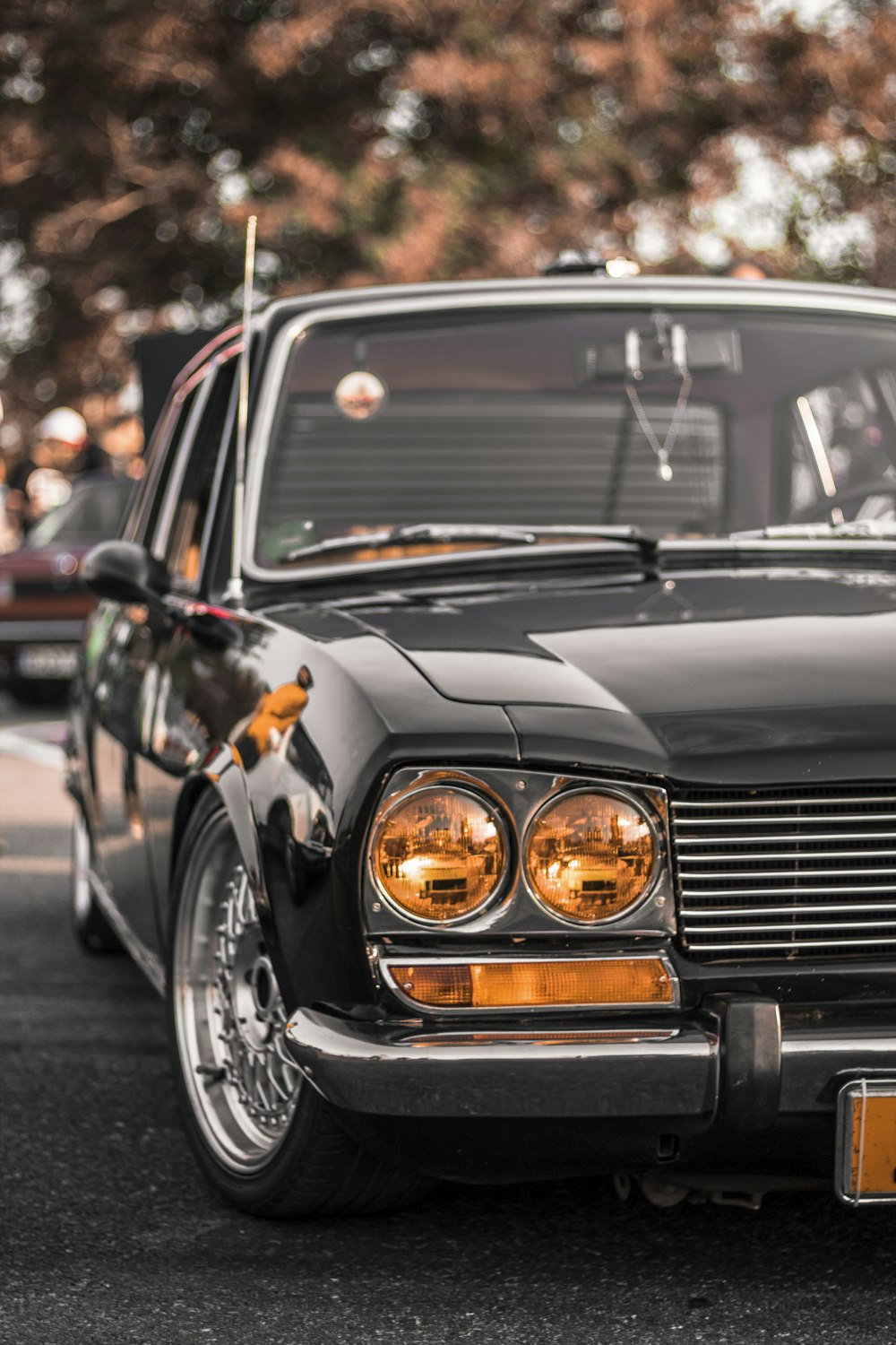 a black car parked on the side of the road