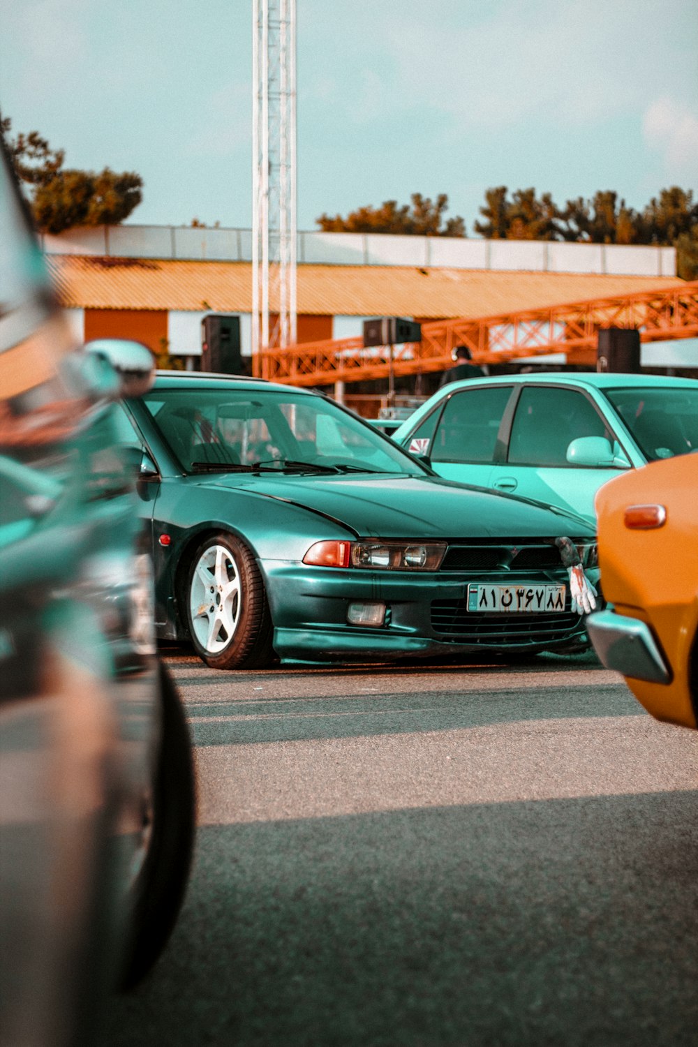 a group of cars parked in a parking lot