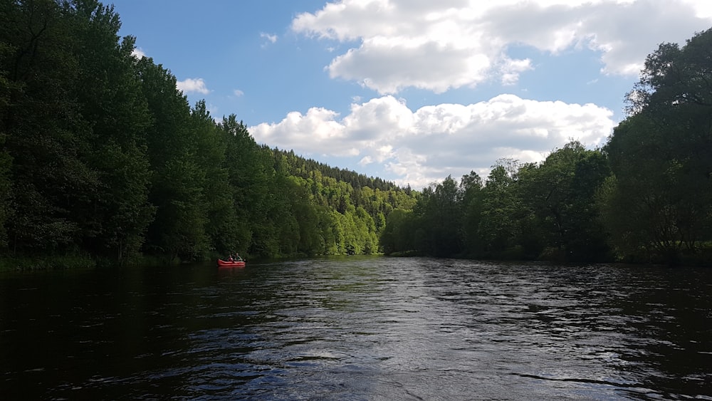 a river with a boat in the middle of it