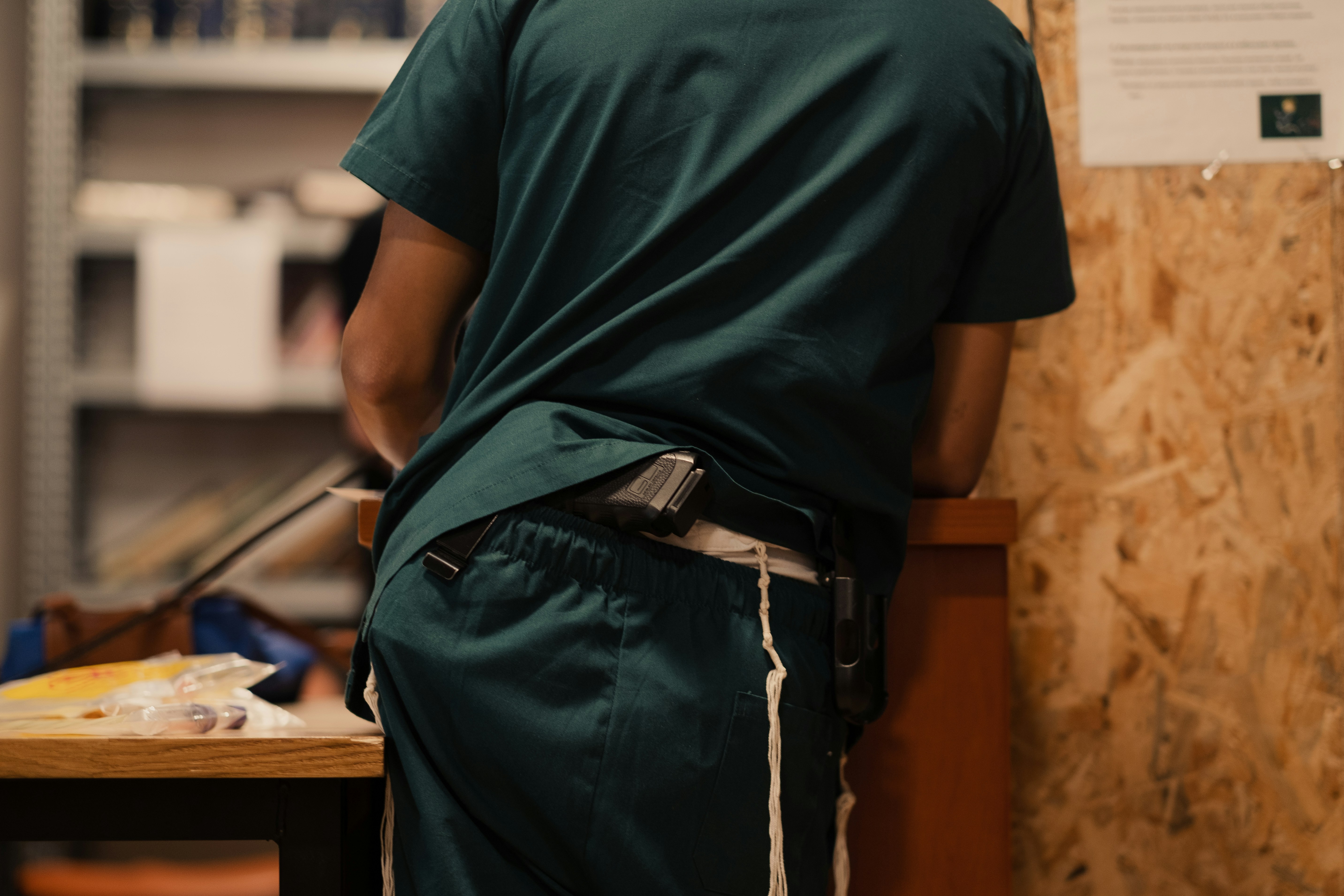 Man wearing compression garment after gynecomastia surgery - men's breast reduction