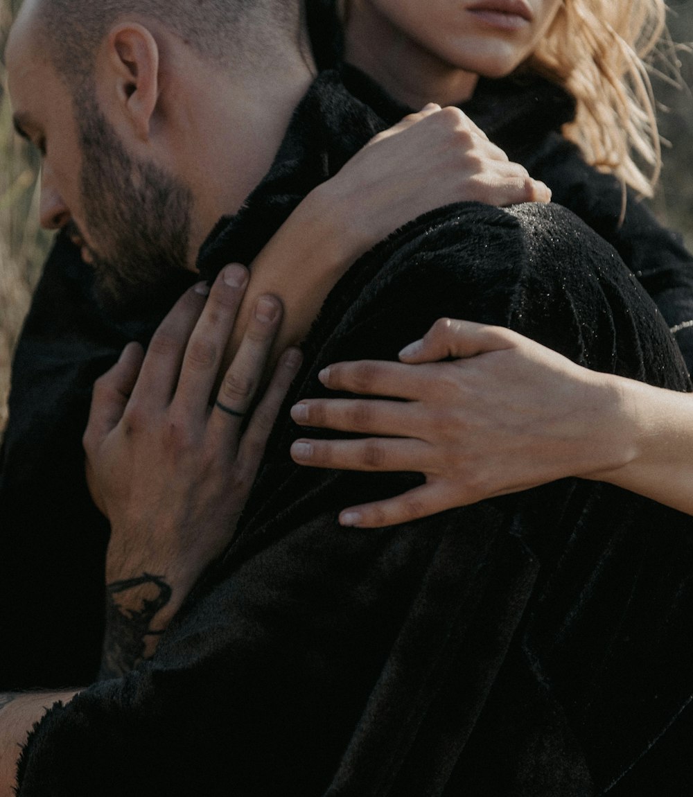 a man and a woman embracing each other