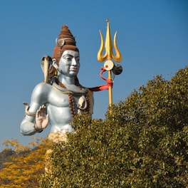 a statue of a person holding a sword