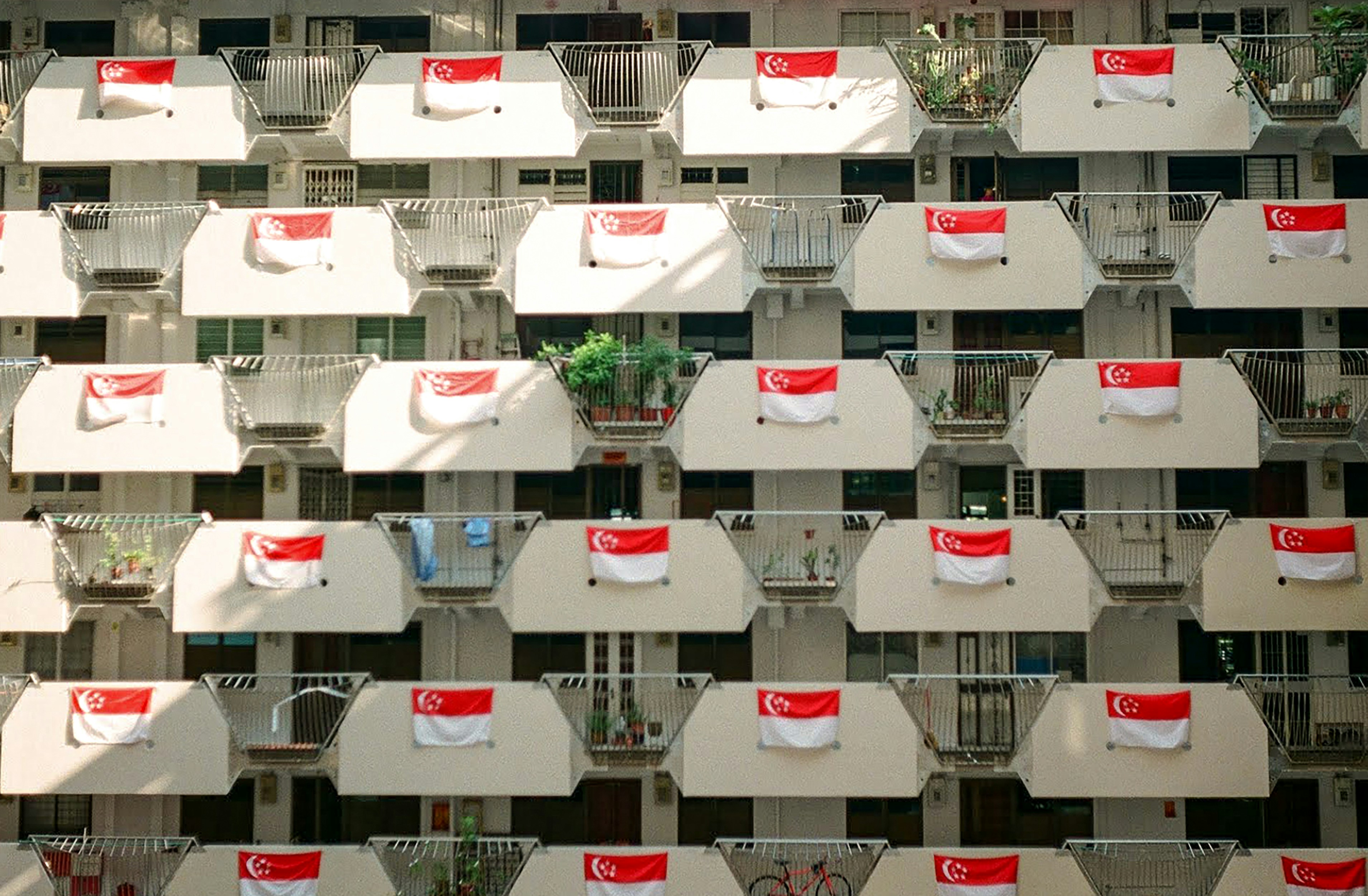 a building with red and white flags on it