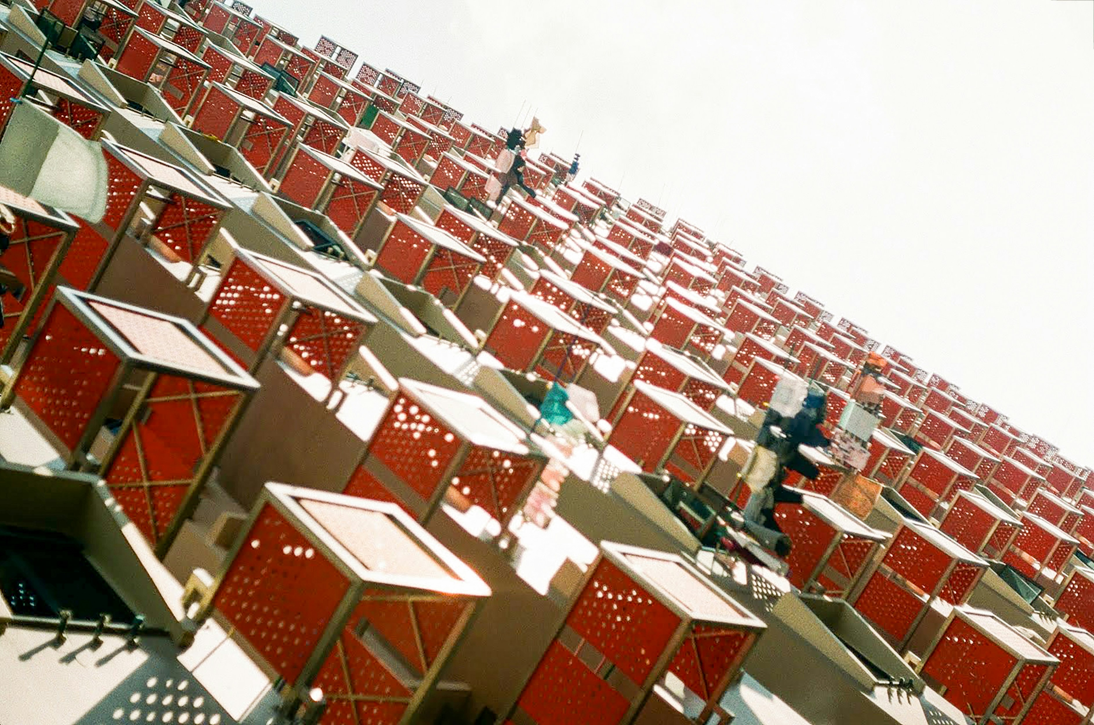a group of red chairs sitting next to each other