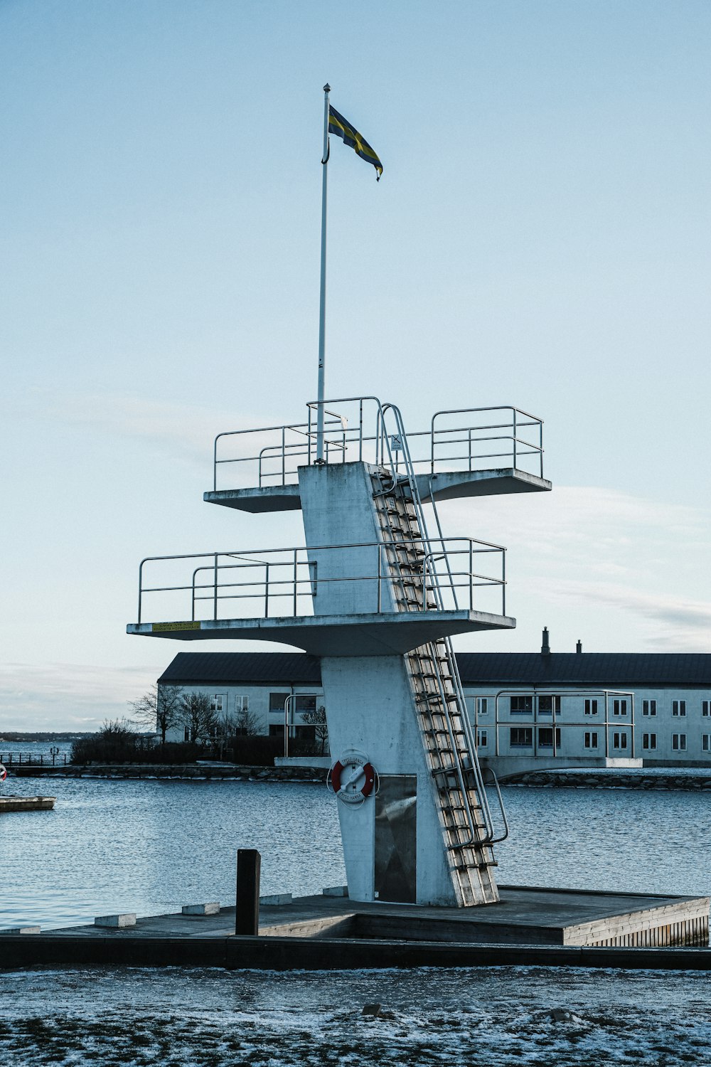 a boat dock with a life guard tower on it