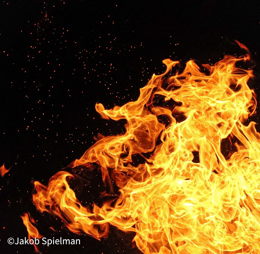 a close up of a fire on a black background