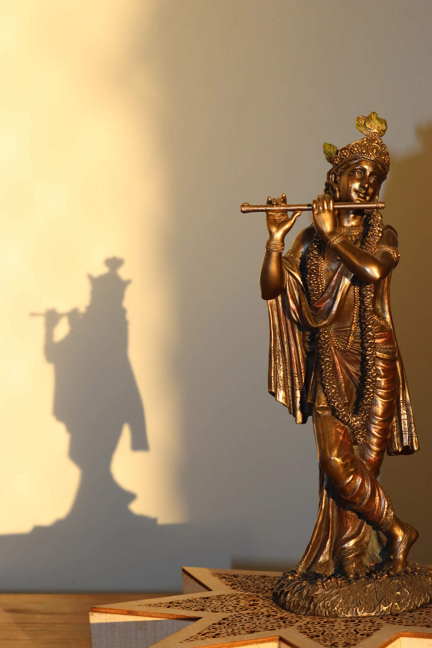 Bronze figure of Krishna playing a flute, showing the expressive detail of sculptural metalwork