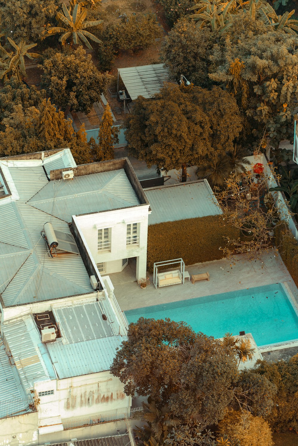 an aerial view of a house with a swimming pool