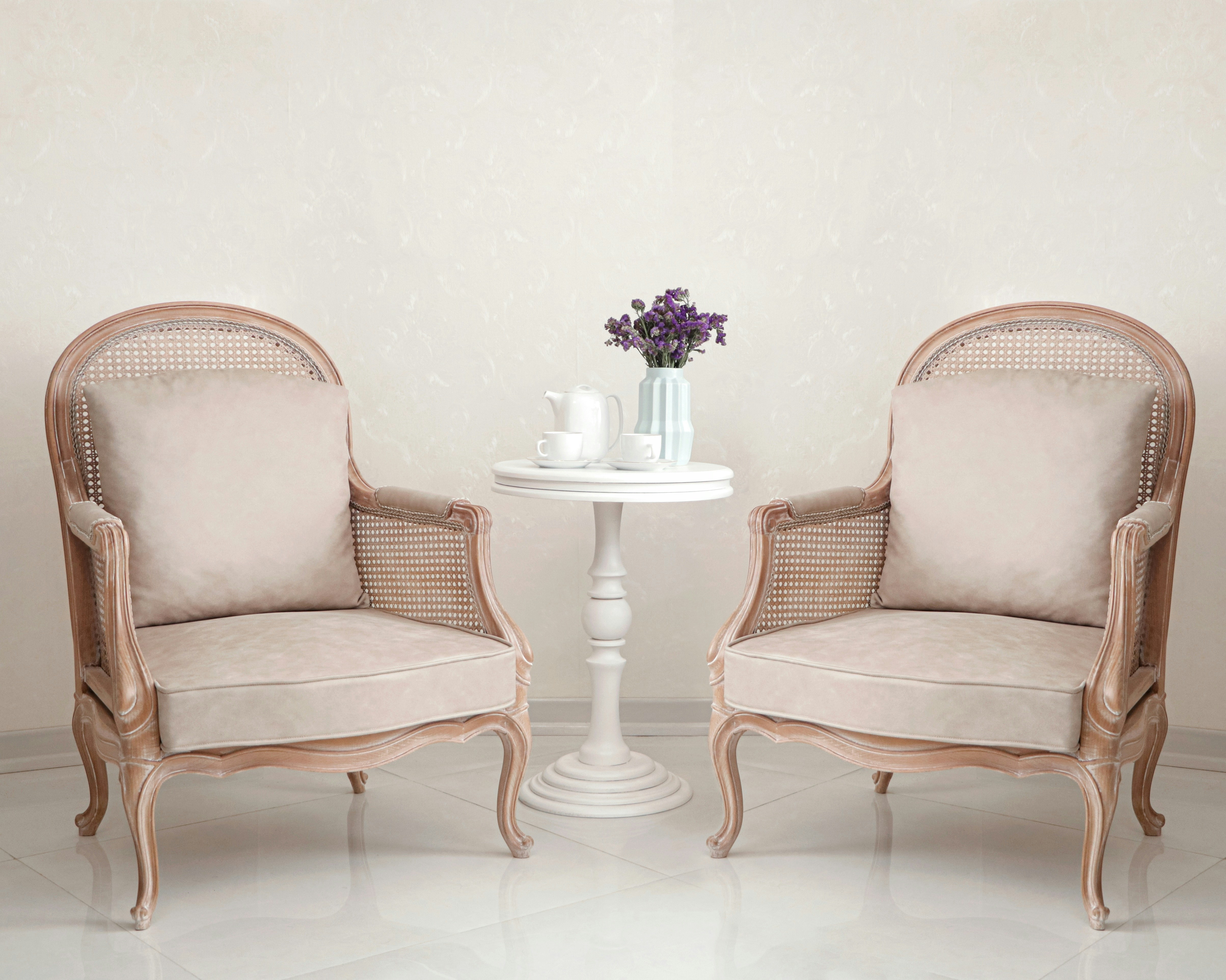 A couple of chairs sitting next to each other photo – Free Furniture ...