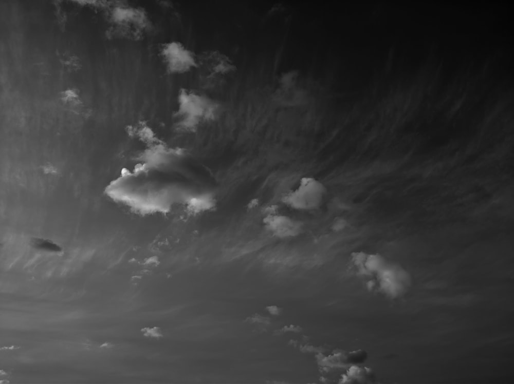 a black and white photo of clouds in the sky