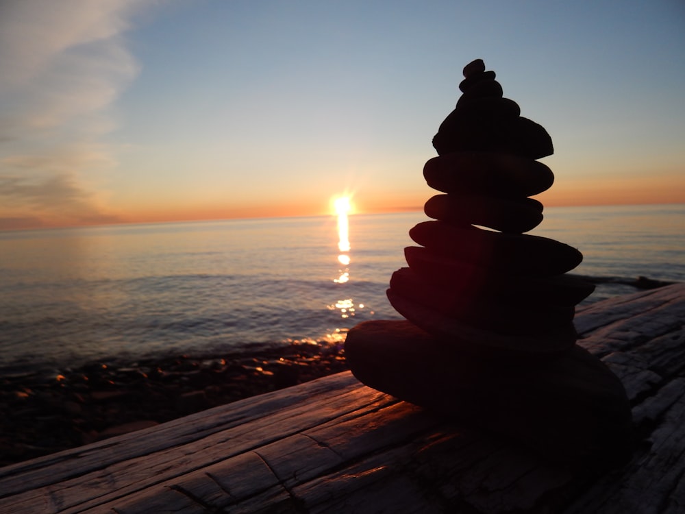 a stack of rocks sitting on top of a wooden table