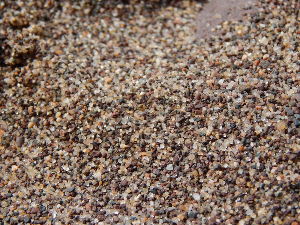 a close up of a sand and gravel surface