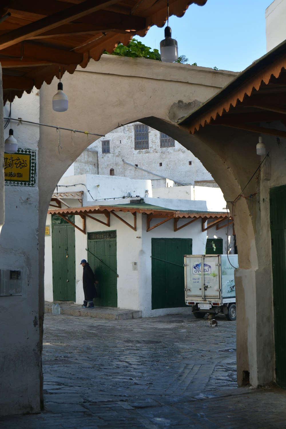 a man is walking through an alley way