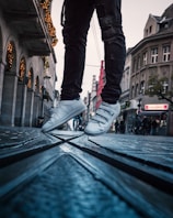 a person standing on top of a metal step