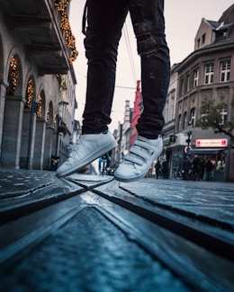 a person standing on top of a metal step