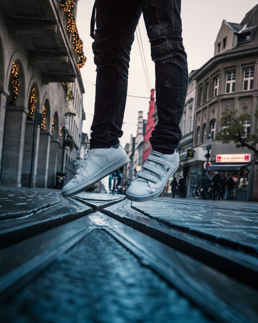 a person standing on top of a metal step