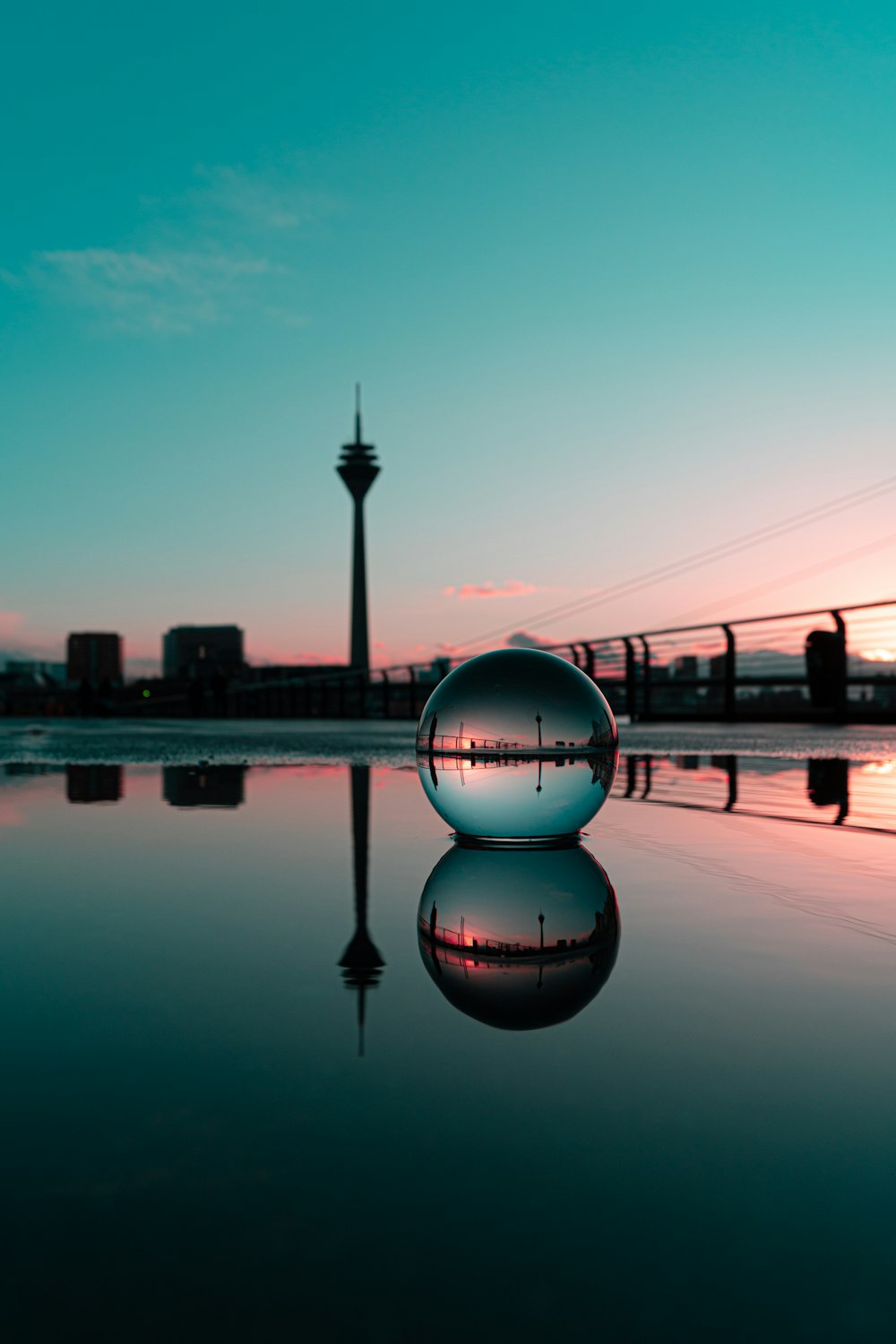 a ball sitting in the middle of a body of water