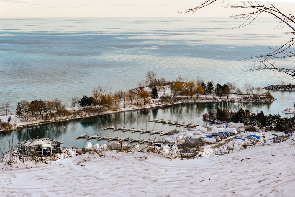 an aerial view of a snow covered lake