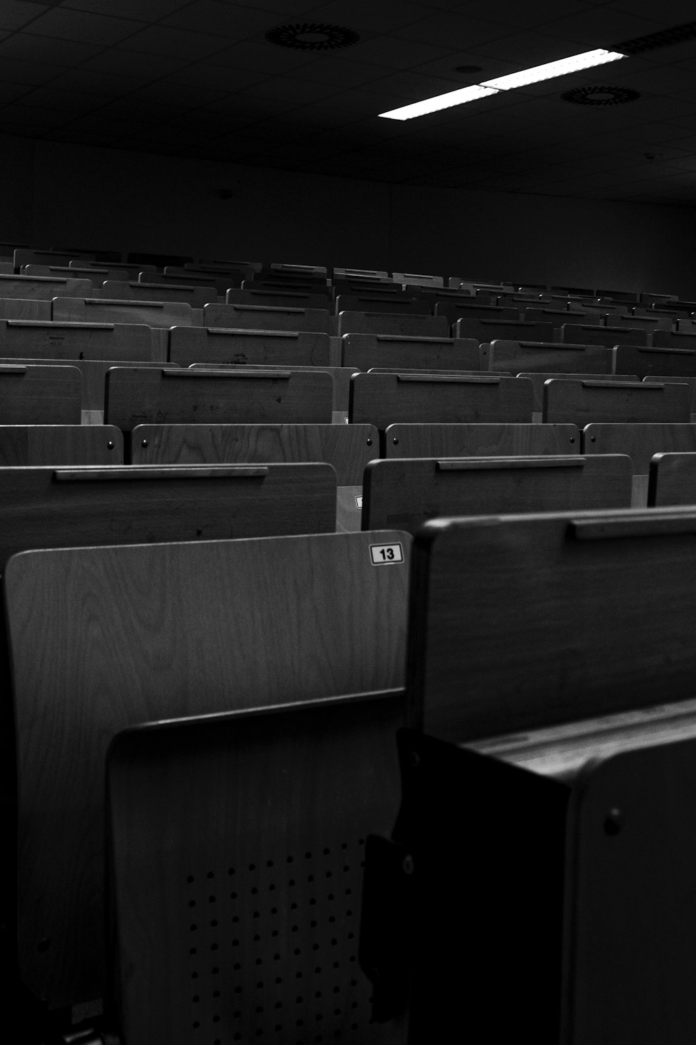 rows of empty seats in a dark auditorium
