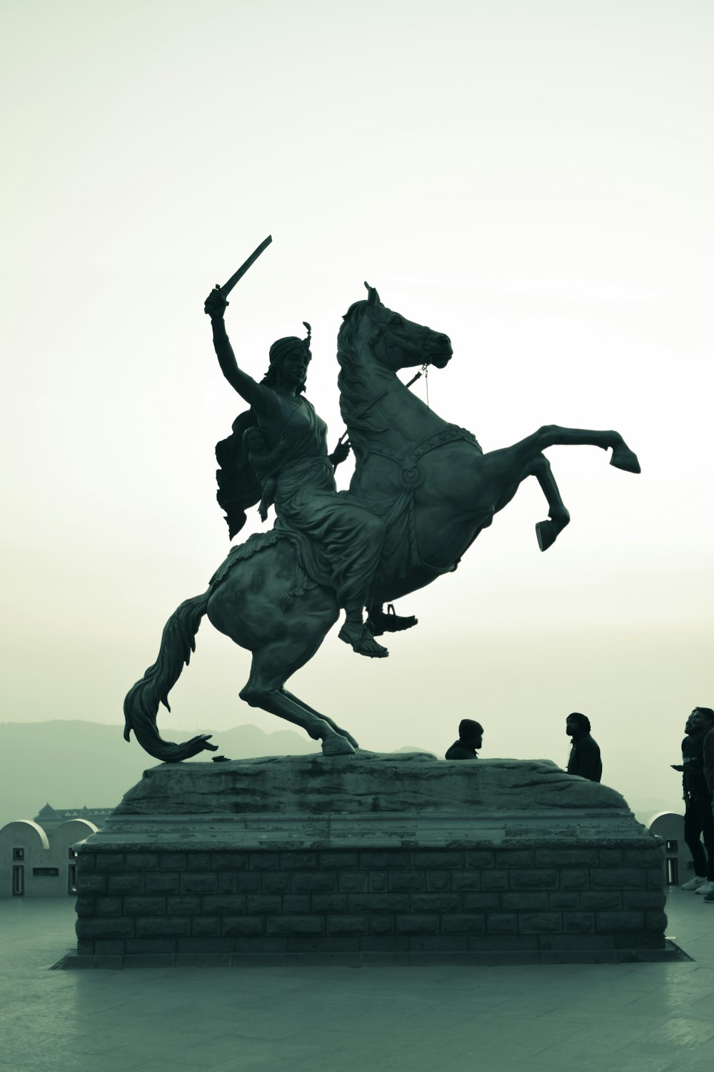 a statue of a man riding on the back of a horse