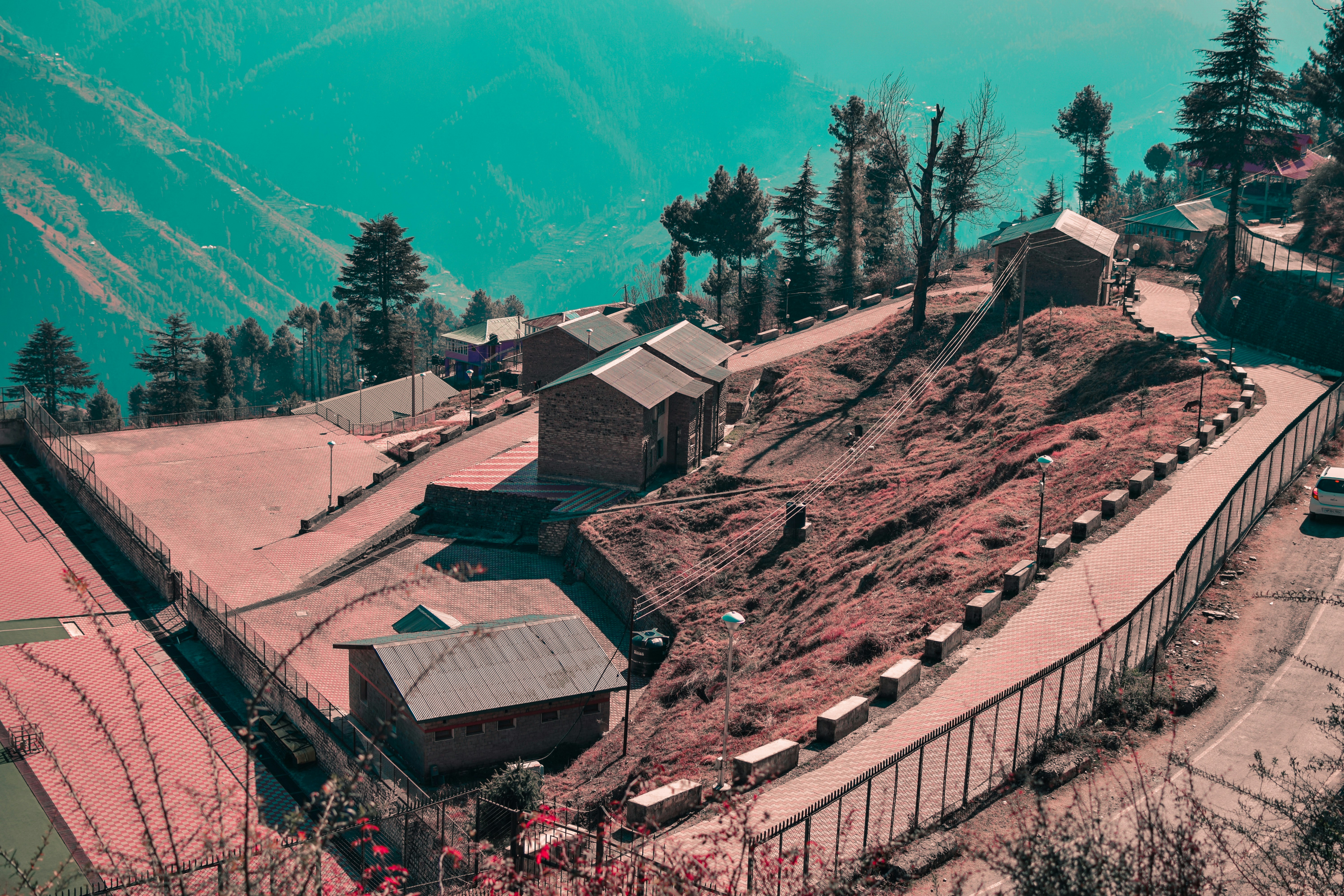 An aerial view of a small village on a hill photo – Free Mountain Image ...