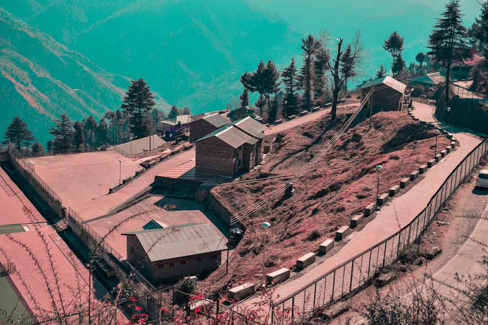 an aerial view of a small village on a hill