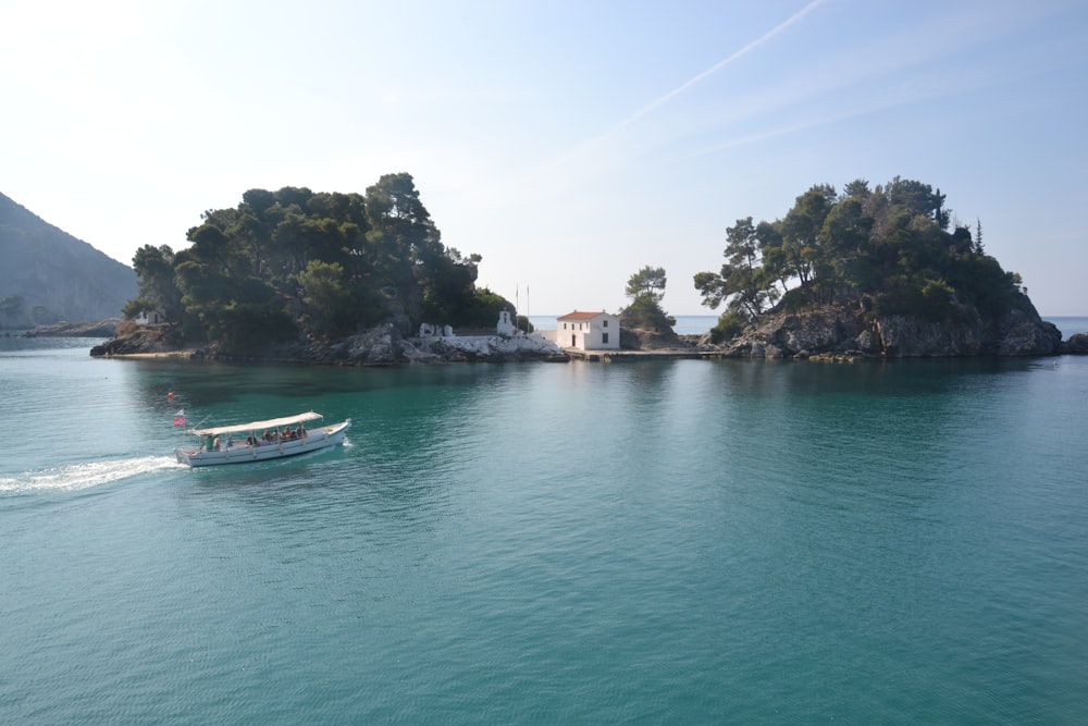 a small boat is in the middle of a large body of water