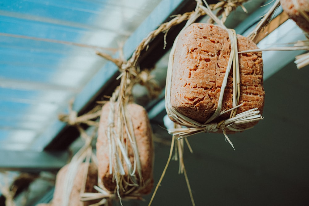 a bunch of bread hanging from a ceiling